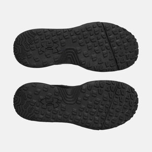 Under Armour black shoe outsoles with slip resistant tread pattern