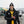 Man wearing ActionHeat jacket and Steelers gear holding a football in the snow