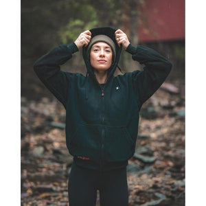 Person wearing a black ActionHeat zip up fleece hoodie with a beanie outdoors