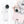 White portable handheld fan with digital display being placed into a small pink handbag