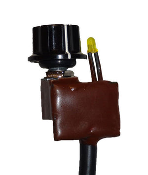 Warm and Safe heat controller with black knob and yellow indicator light