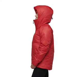 Side profile of a person wearing a red insulated hooded jacket