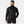 Man wearing a black Helly Hansen quilted puffer jacket