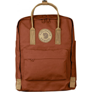 Fjallraven Kanken backpack in terracotta brown with tan leather handles and logo patch