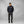 Man wearing a navy FjallRaven sweatshirt and dark trousers