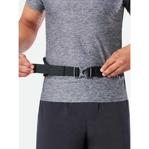 Person adjusting a black adjustable waist belt with a plastic buckle