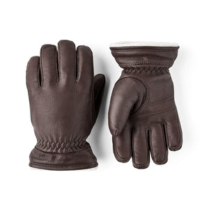 Pair of brown leather gloves with white fleece lining