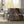 Beautyrest brown patterned electric throw blanket draped over a grey sofa