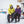 Man and woman wearing winter jackets and Baffin mittens sitting on a wooden porch in the snow