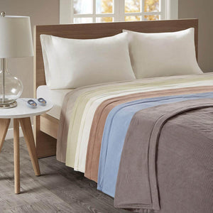 Beautyrest electric blanket with ribbed texture in multiple color options on a bed