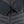 Close up of black quilted jacket sleeves and central zipper