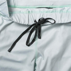 Light blue athletic shorts with black drawstring waist