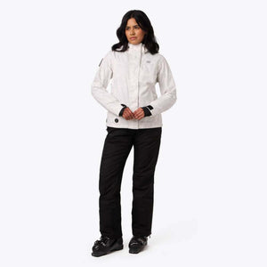 Person wearing a white patterned ski jacket and black ski pants with ski boots
