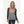 Woman wearing a grey and black long sleeve heated base layer top with visible heating elements