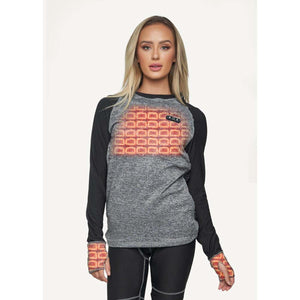 Woman wearing a grey and black long sleeve heated base layer top with visible heating elements