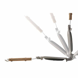 Metal sandwich press with wooden handles showing opening motion