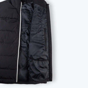 Interior view of Mobile Warming black puffer vest showing lining and pocket