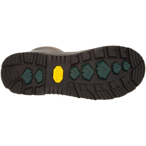 Brown Vibram boot outsole with green traction lugs