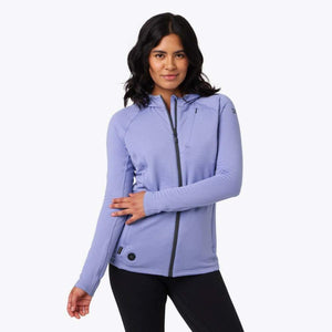 Woman wearing a lavender long sleeve zip up hoodie with a textured fabric