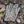 Glacier Glove camouflage pattern outdoor gloves on a bed of fallen leaves