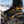 Hillsound traction device attached to a yellow hiking boot on a snowy mountain