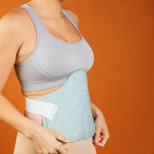 Person wearing a light blue abdominal wrap with white straps against an orange background