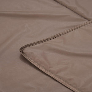 Close up of brown fabric showing stitched hem detail