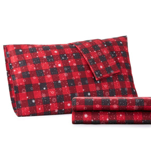 Shavel red and black buffalo plaid pillowcase and folded sheet set with white snowflake pattern