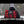 Person wearing a red and black plaid Heater Body Suit rolled into a backpack with straps