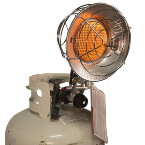 Propane tank heater with glowing orange burner and safety cage