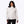 Woman wearing a white patterned ski jacket with black pants