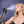 Woman using an Alpha Cool misting water bottle to spray her face