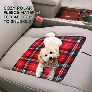 Zone Tech red plaid polar fleece pet mat on a car seat with a small dog lying on it