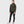 Woman wearing a dark green Fjallraven fleece hoodie and black trousers