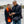 Woman wearing ActionHeat heated scarf and man wearing ActionHeat heated vest looking at a smartphone