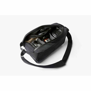 Open Bellroy camera sling bag containing camera body and lenses