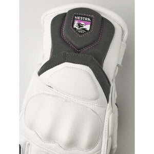 White Hestra glove with grey knuckle padding and Hestra logo patch