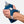 Nathan blue handheld water bottle with adjustable mesh strap held in hand