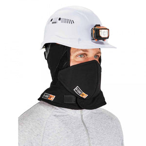 Worker wearing a white hard hat with headlamp and black N-Ferno FR balaclava face mask