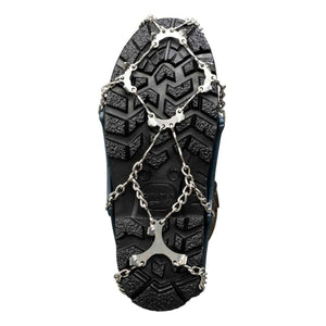 Snowline traction cleats attached to the sole of a black boot