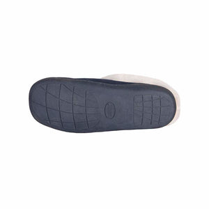 Bottom view of a navy blue slipper with a textured rubber sole