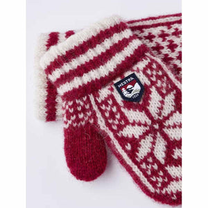 Hestra red and white patterned wool mittens with ribbed cuffs and brand logo patch
