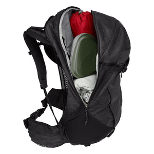 Thule Topio 30 backpack with open main compartment showing packed gear
