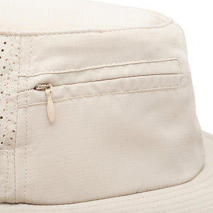 Close up of beige Mission bucket hat with side zipper pocket and mesh panel