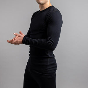 Man wearing a black Merino Skins long sleeve thermal shirt