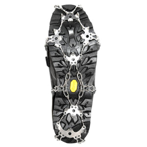Metal traction cleats attached to the sole of a black hiking boot