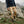 Person wearing FjallRaven beige cargo trousers and hiking boots on a rocky mountain trail