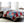 Bed with red and blue plaid patchwork comforter and white sherpa lining