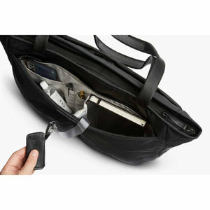 Open Bellroy tote bag showing internal pockets with a notebook and accessories