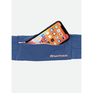 Blue Nathan running belt with a smartphone tucked into the zippered pocket
